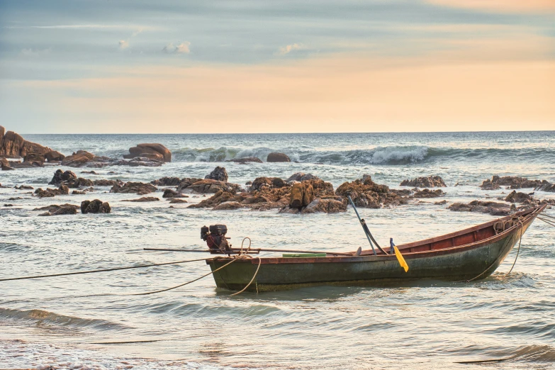 a canoe is on the water with a rope