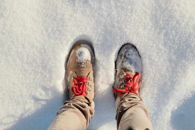 a person wearing a pair of skis standing in the snow