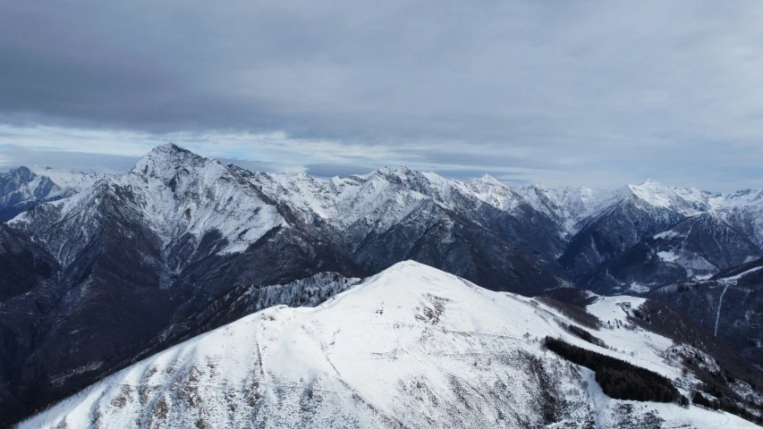 a view of mountains, including the peaks and a ski slope