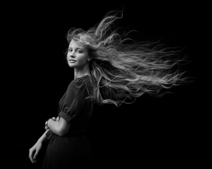 a woman with long hair, in black and white