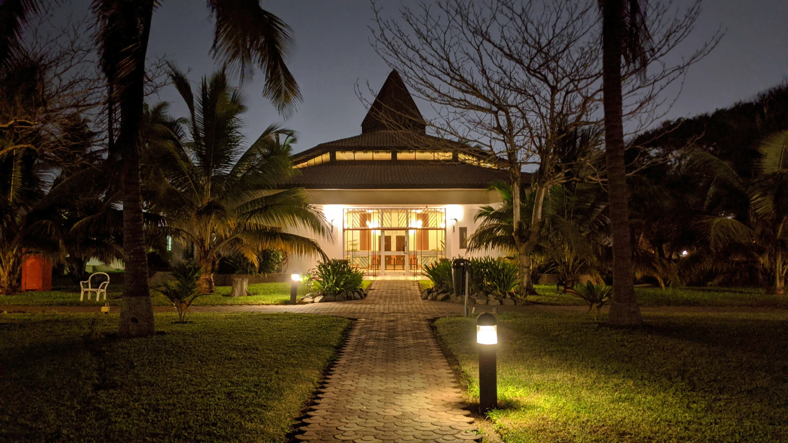 a beautiful house is lit up in the dark