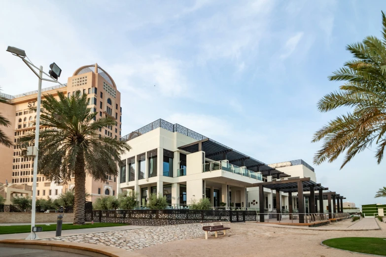 a building in a tropical area with palm trees