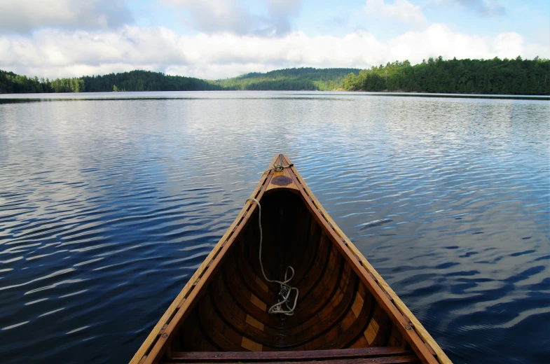 a boat is out in the water while a person rows down it