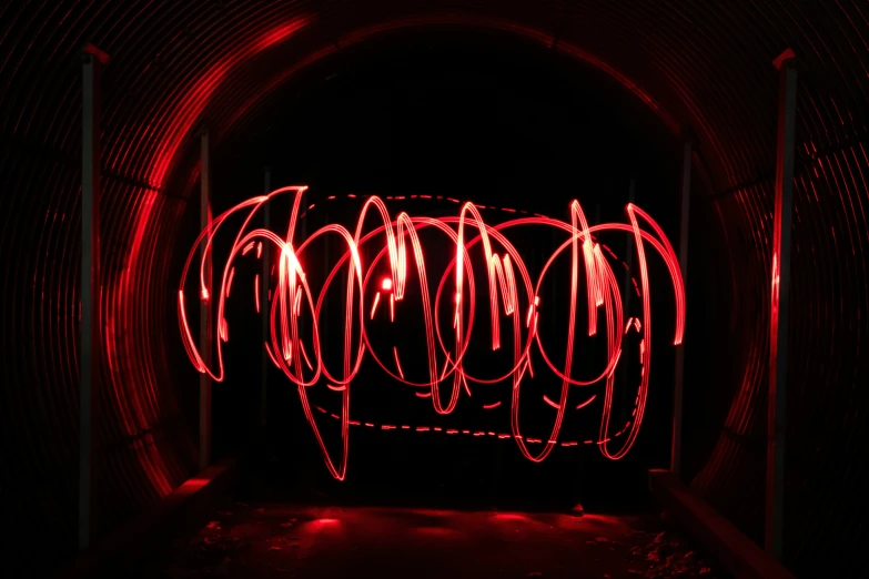 a tunnel with a light painting in the middle