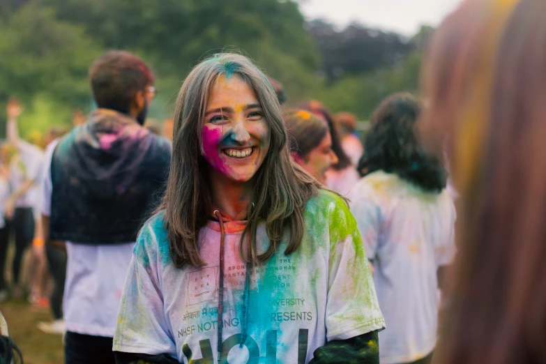 a young lady with her painted face at a color run