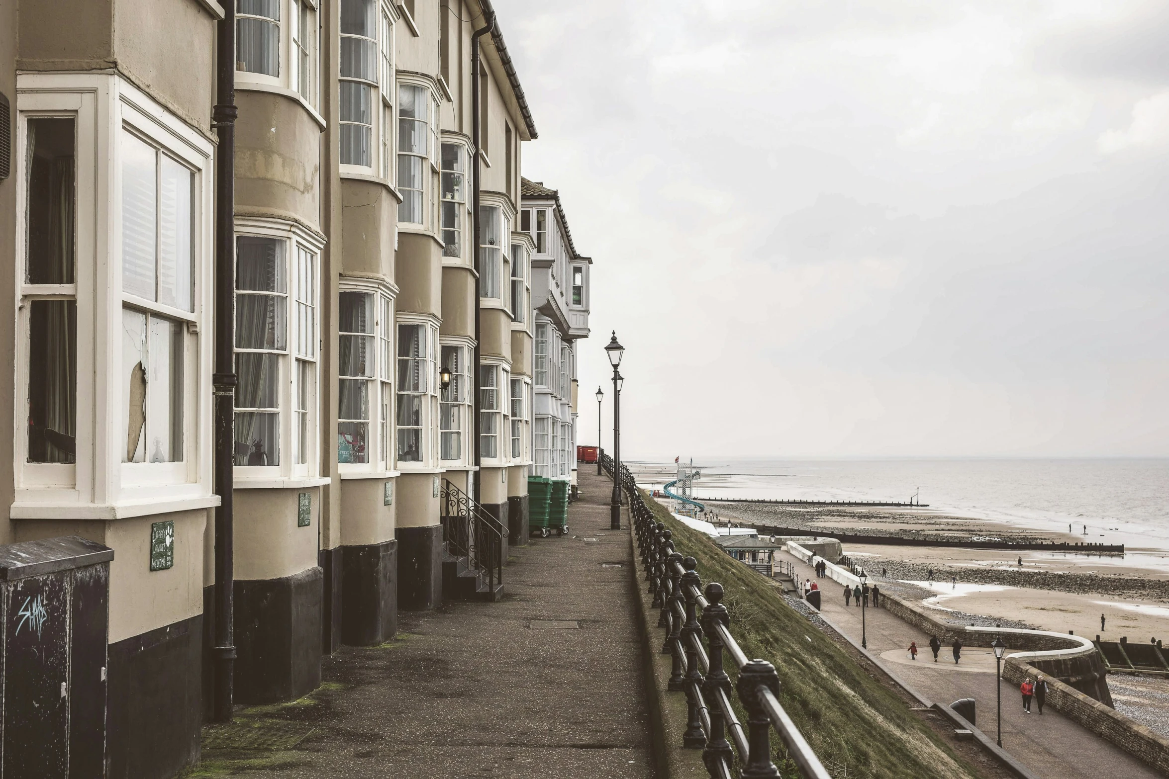 a couple of buildings with some beach next to them