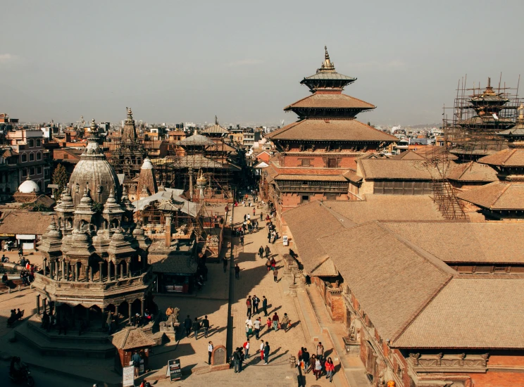 many ornate buildings surrounding a city and a large temple