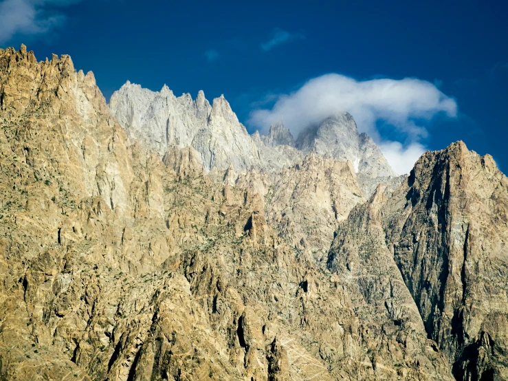 view of mountains and clouds in the blue sky