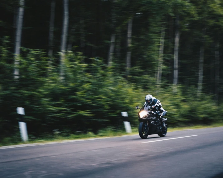 a person riding a motorcycle on a road