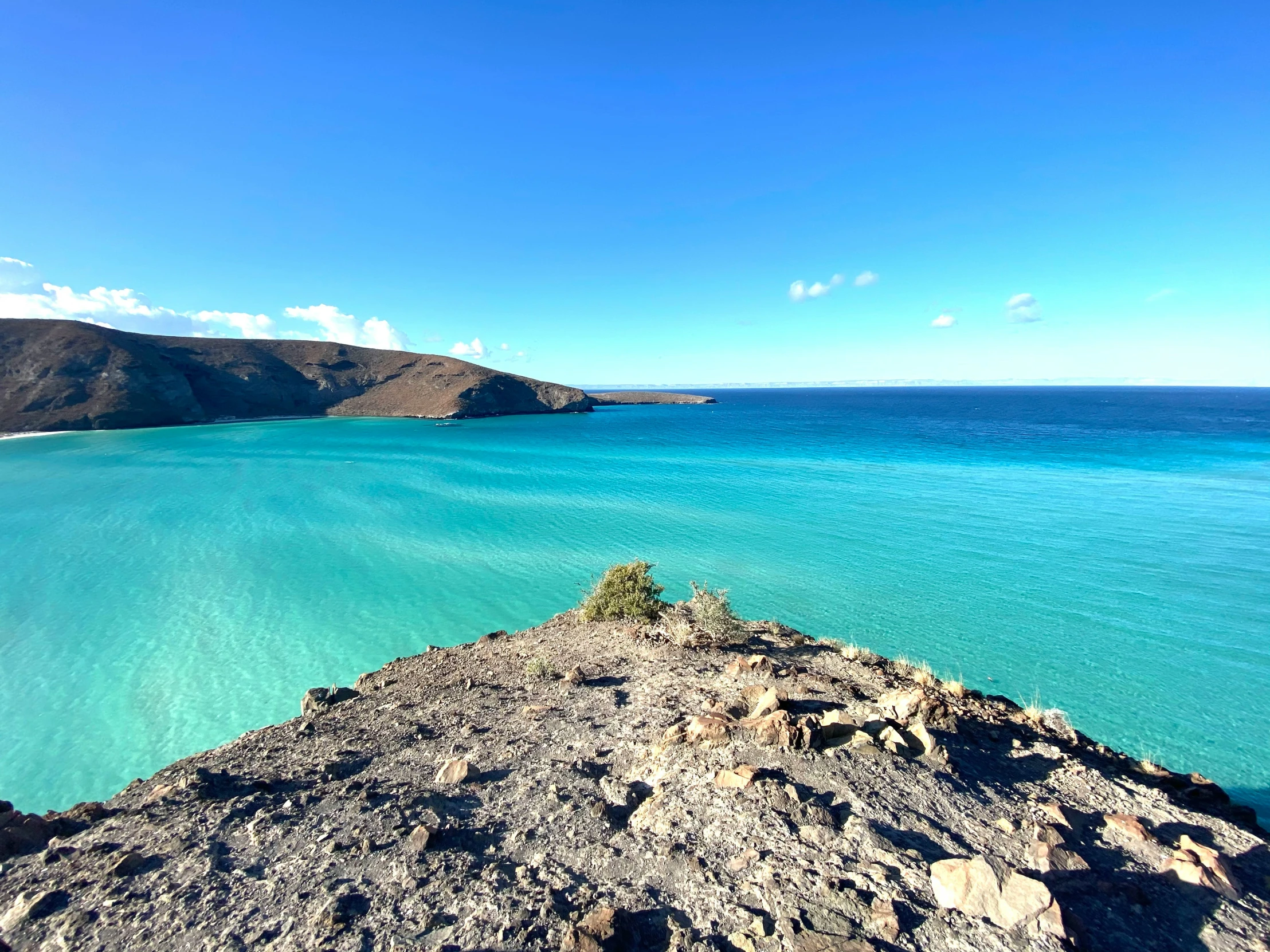 the water and hills of the ocean from an overlook point