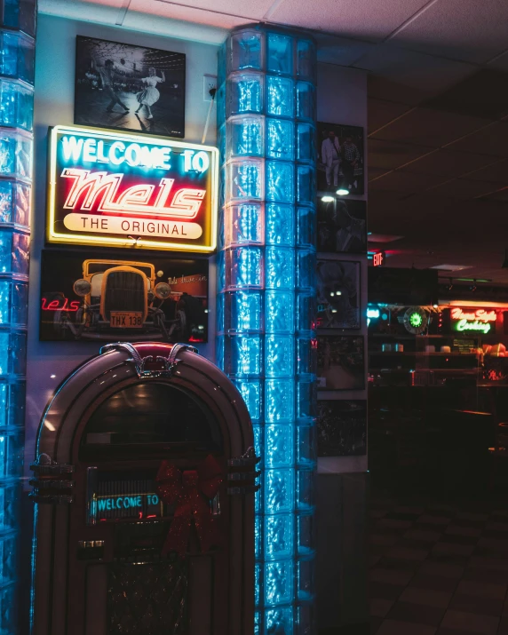 an atm machine on display under a neon sign