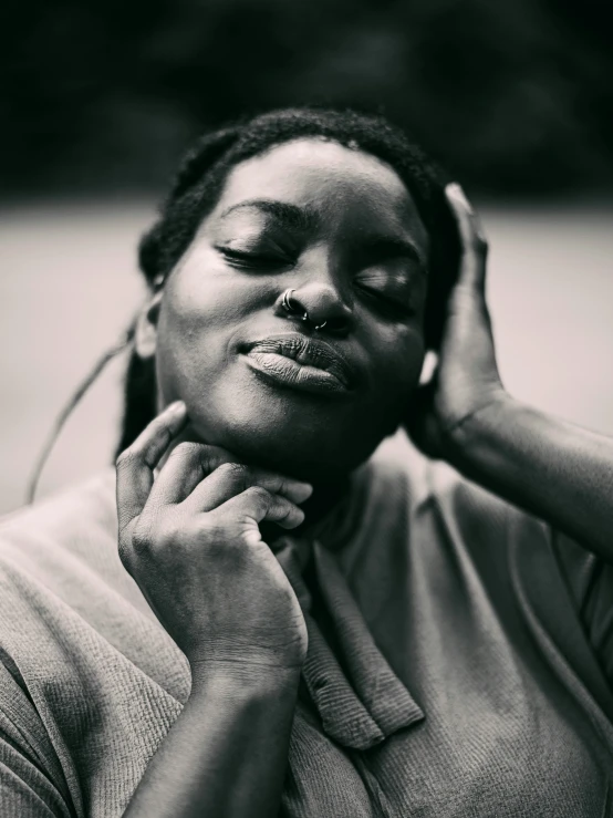 black and white pograph of woman with a large nosering