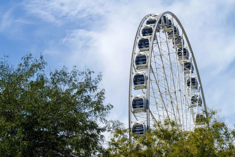 a ferris wheel in front of a blue sky