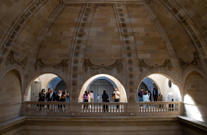 group of people standing on steps inside a building