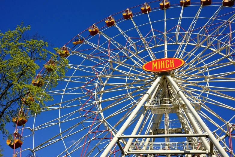 a ferris wheel in an amut park during the day