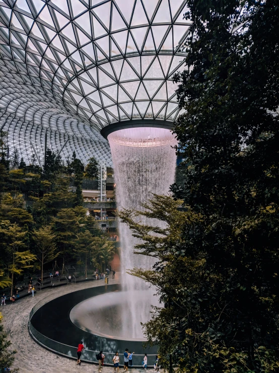 a park with a fountain filled with lots of water