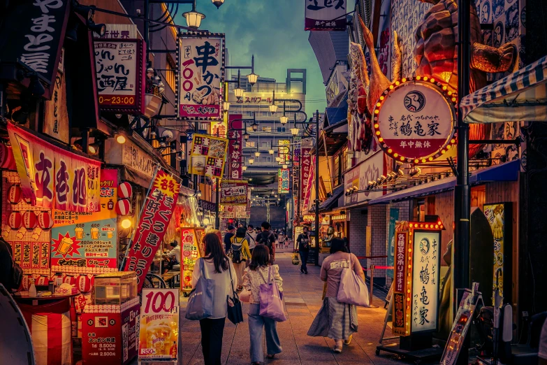 people are walking down a very brightly lit street