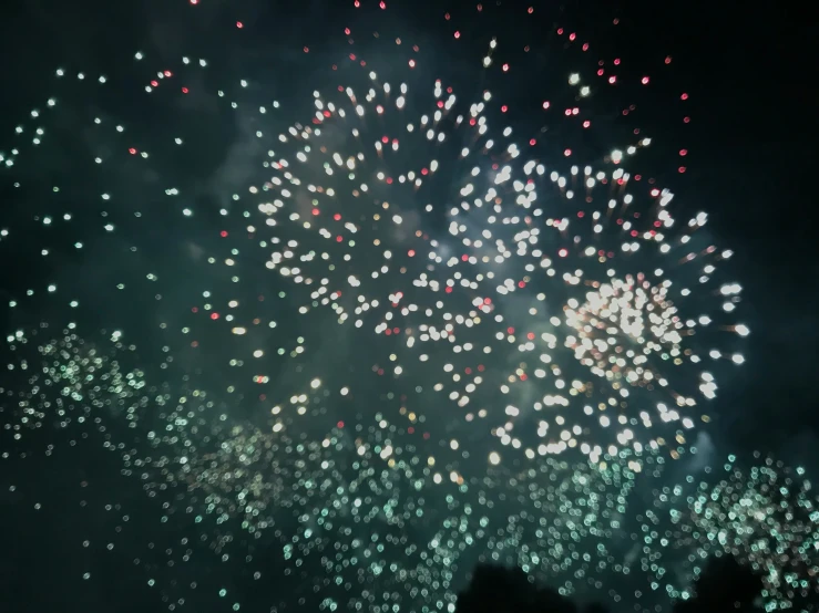 a very colorful fireworks is lit up the night sky