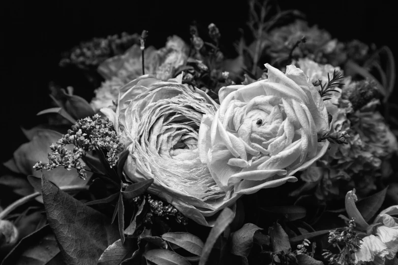 a bouquet of flowers in black and white