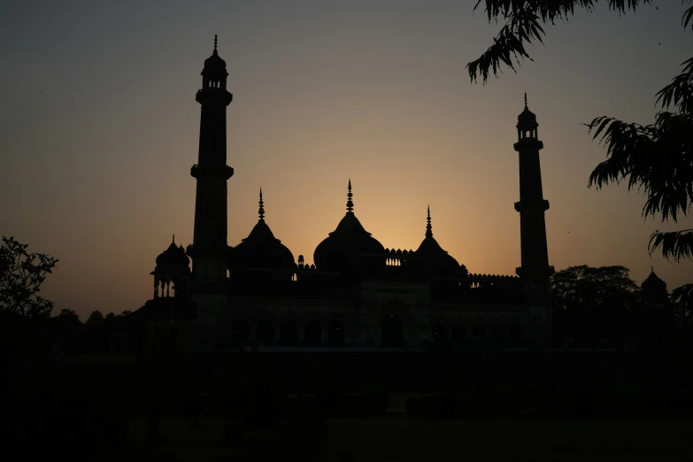 the large building is tall and has spires