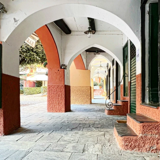 an alley with a lot of archways between it