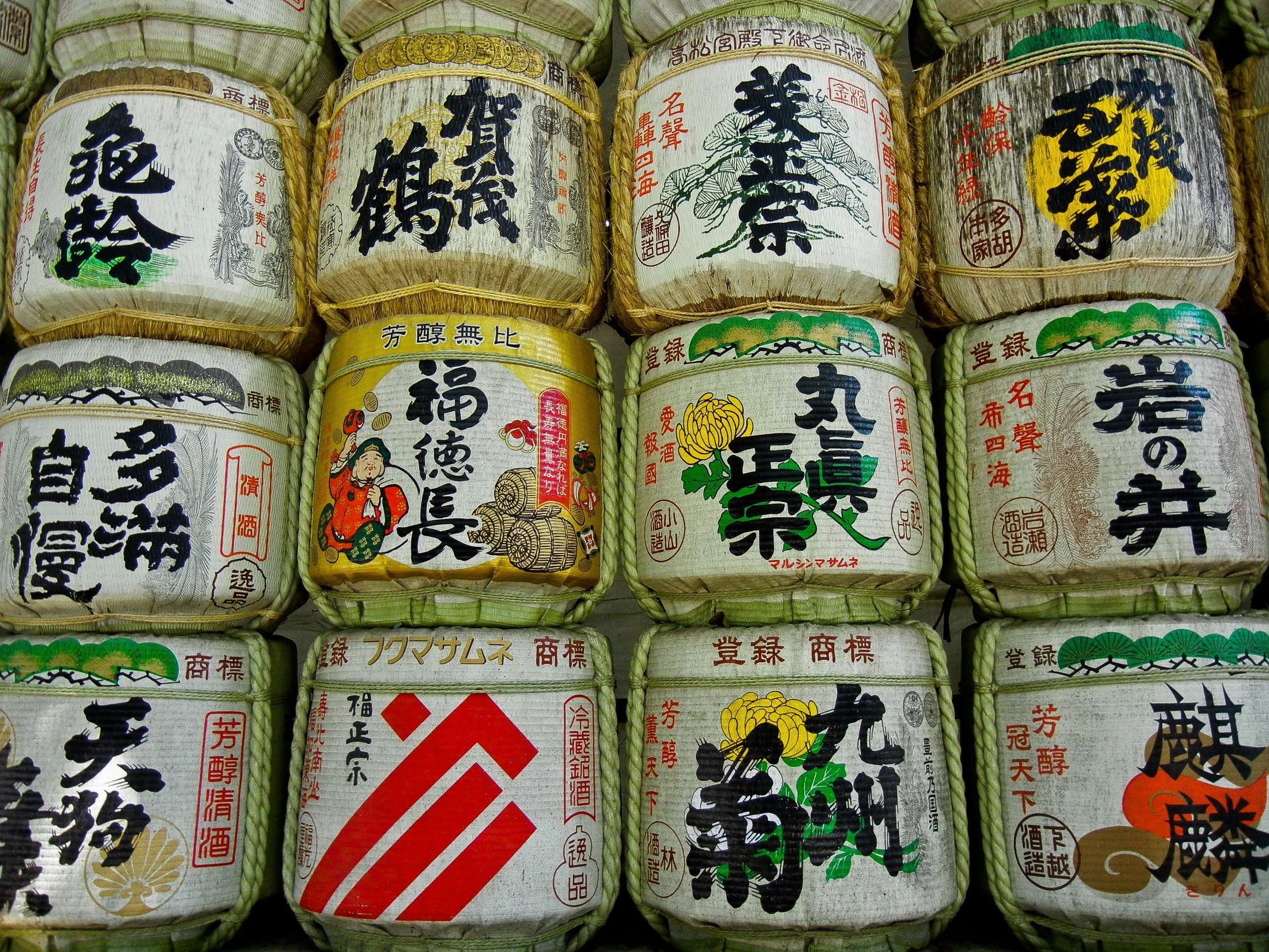 rows of sake - related sake jars stacked with japanese characters