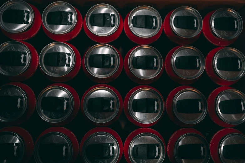 a display case filled with many different sized beer cans