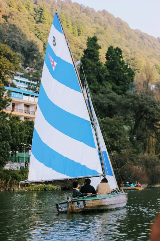 two people on a boat sailing in the water