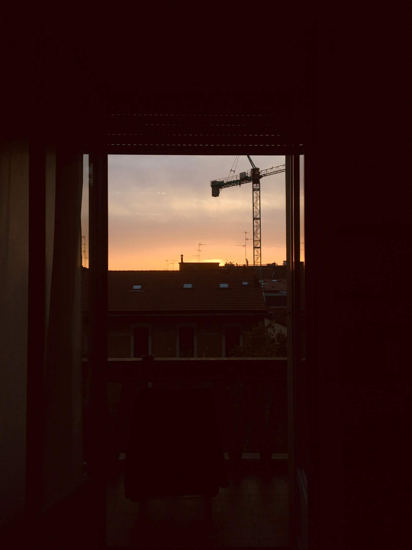 a view out of a window that shows the sunset