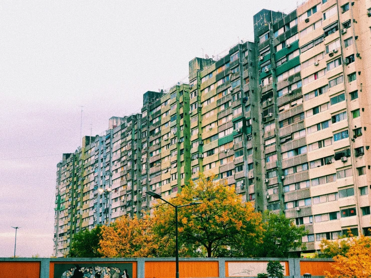 a long view of tall buildings in a city with trees