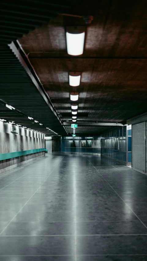 an empty public parking space with concrete floors