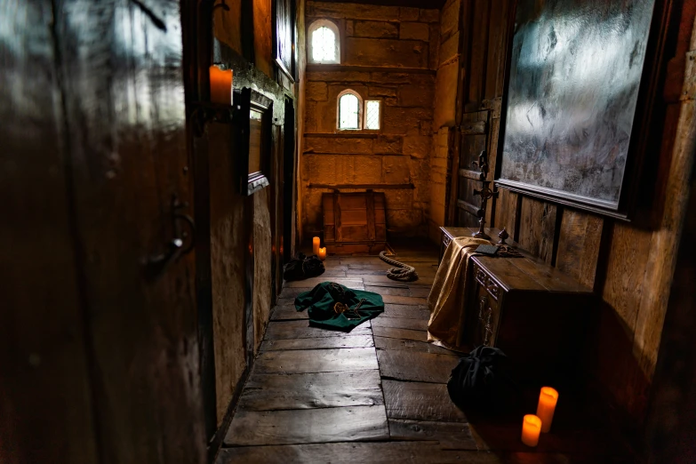 an empty hall with some yellow candles in the room