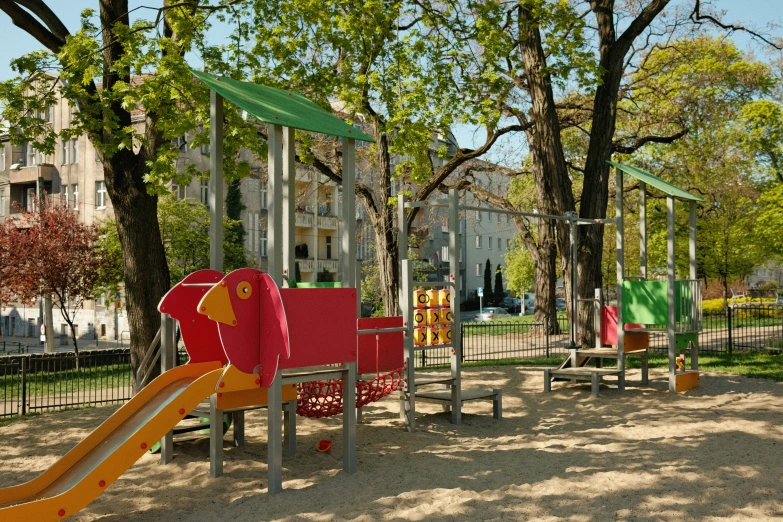 a park with a playground and several colorful slides