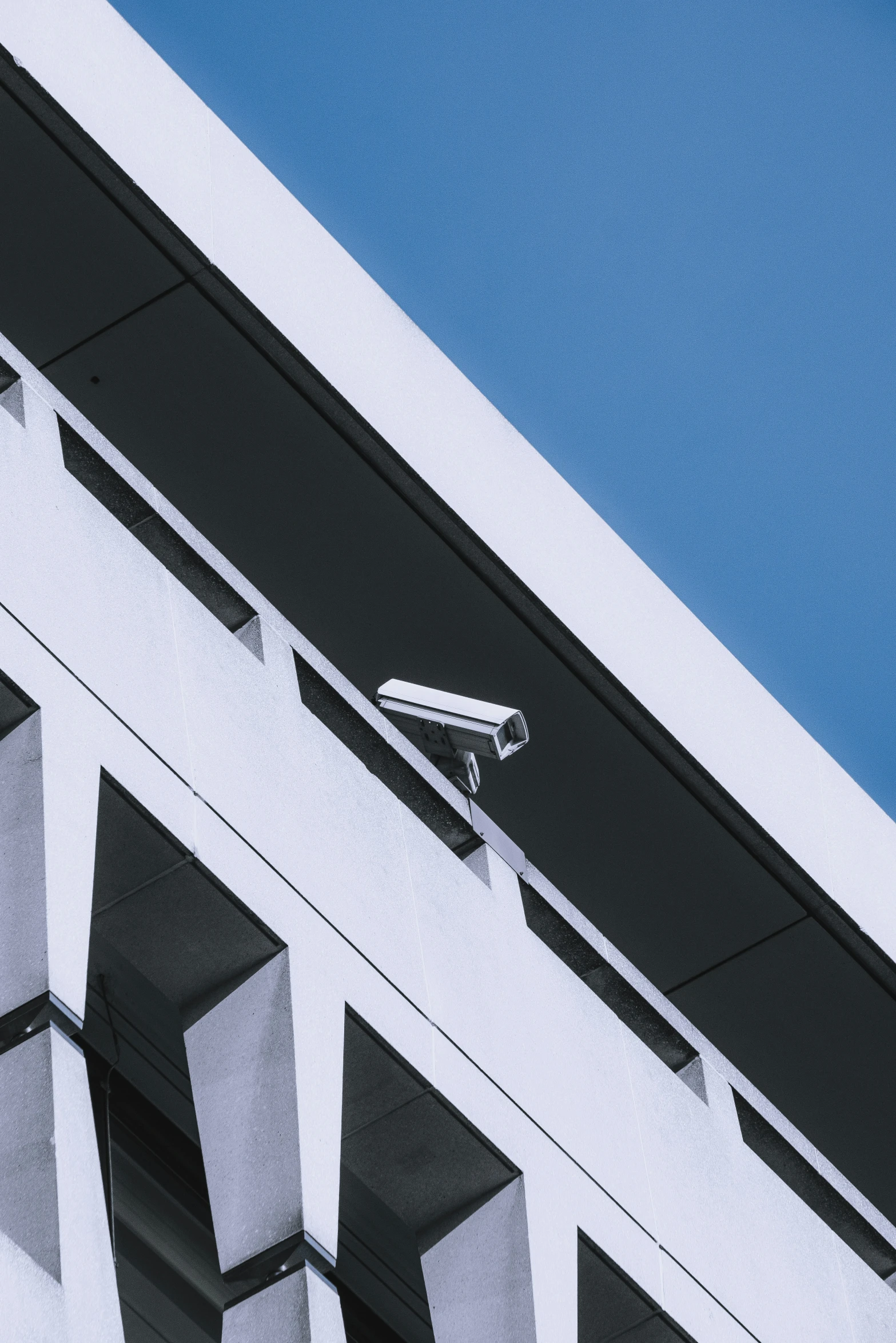 a camera is mounted on the top of a building