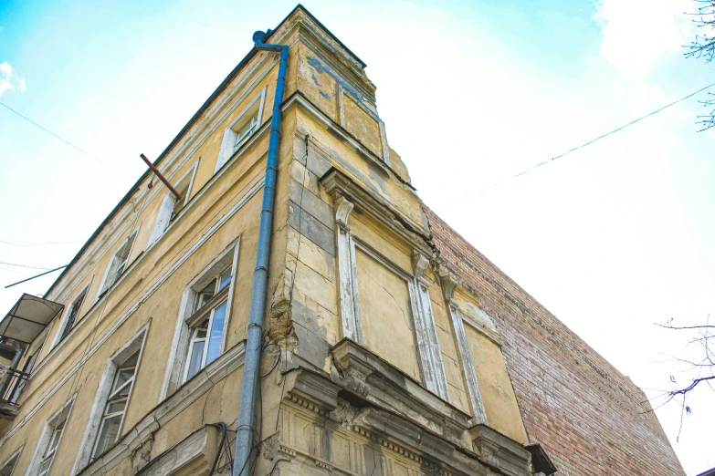 an old building with a blue sign on top