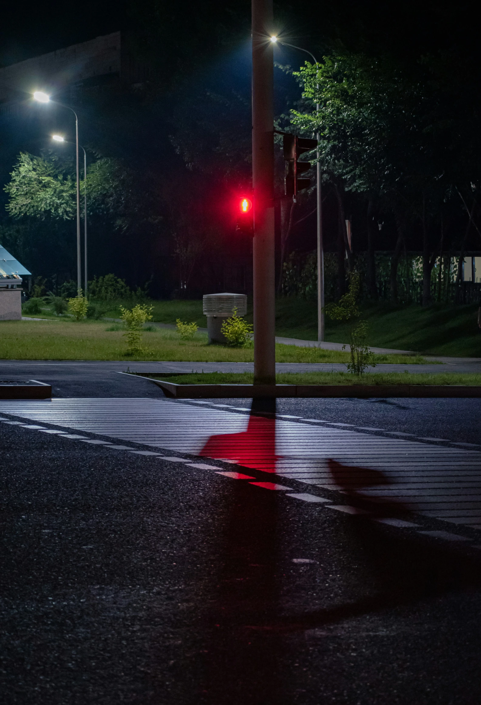 a red traffic light on the side of the road