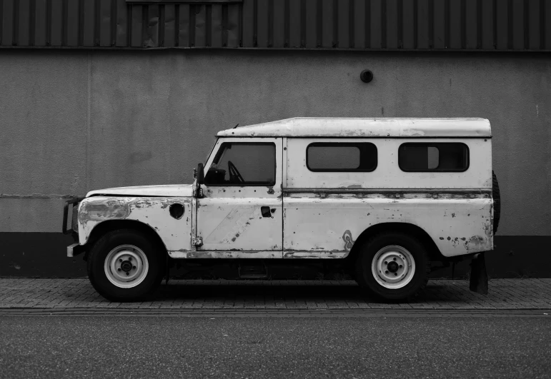 a black and white po of a old, rusted vehicle