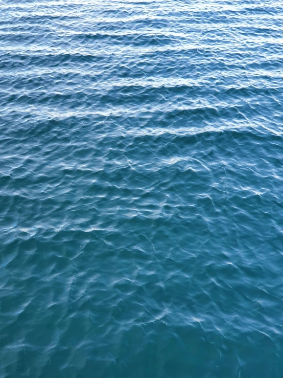 blue ocean waves and horizon seen from the water