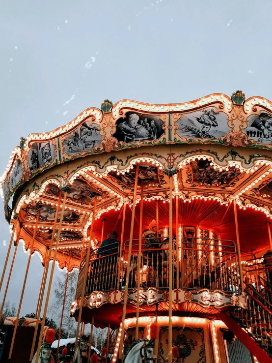 a merry go round with ornate carvings in the sky