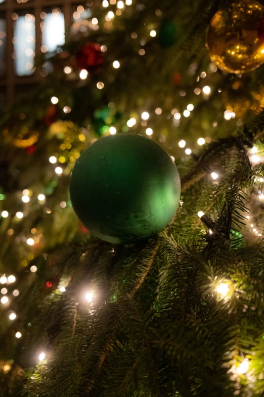 a christmas tree with balls and lights