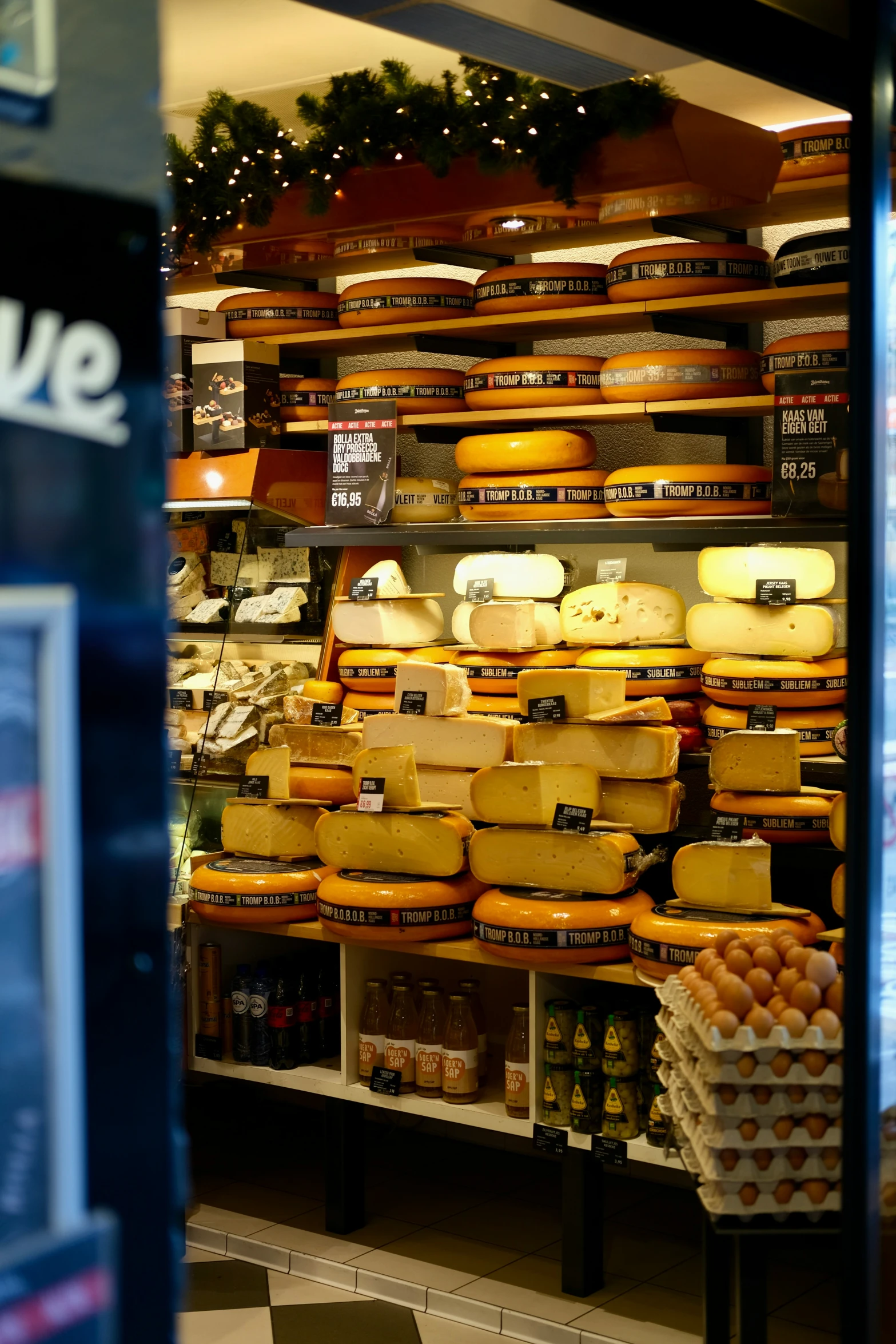 a display in a supermarket filled with lots of cheese