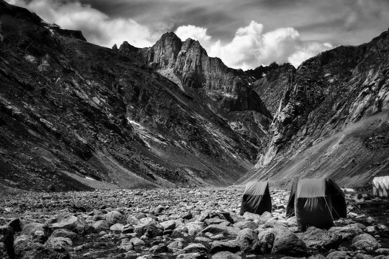 the black - and - white po shows a rocky desert landscape