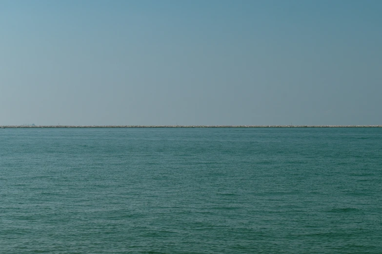 large body of water with large area off in distance