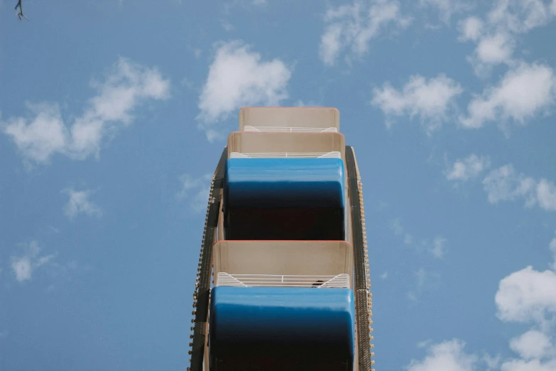 a roller coaster that is on the outside of a building