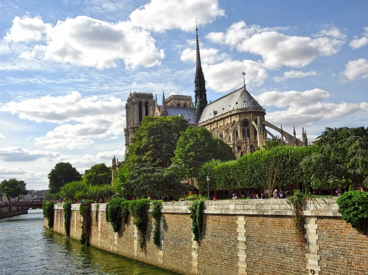 the view of an old building, across a river from another building