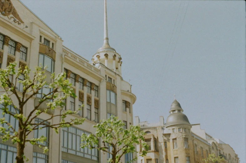 a view of some very tall building in front of the clock tower