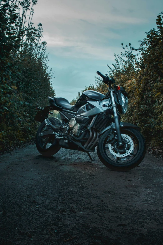 a motorcycle is parked on the side of a road