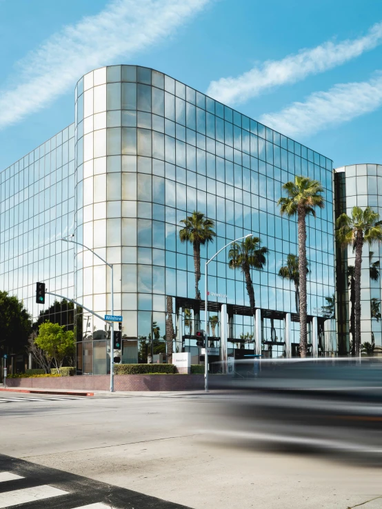 an office building next to a busy intersection in a city