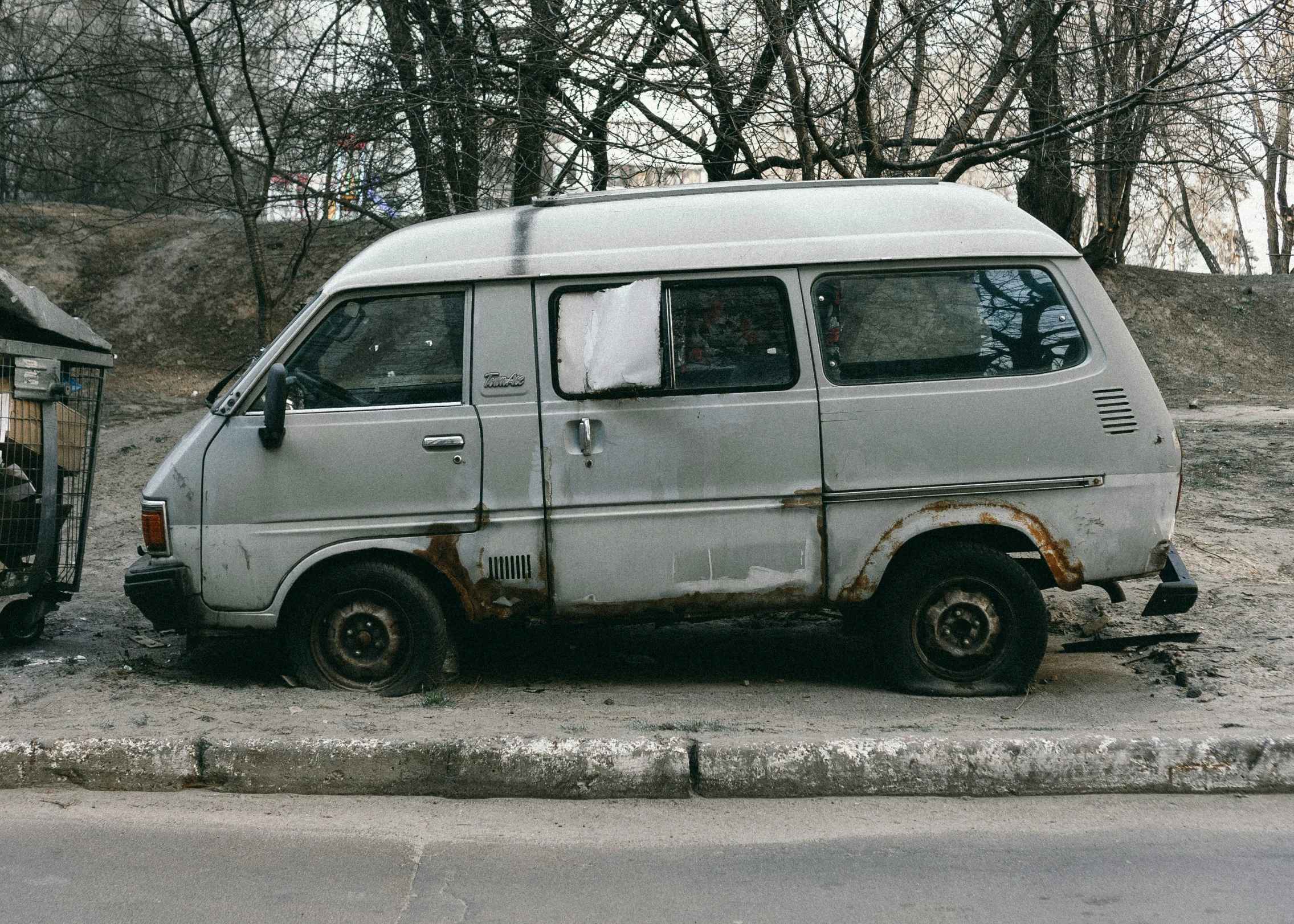 an old van that is dirty and broken