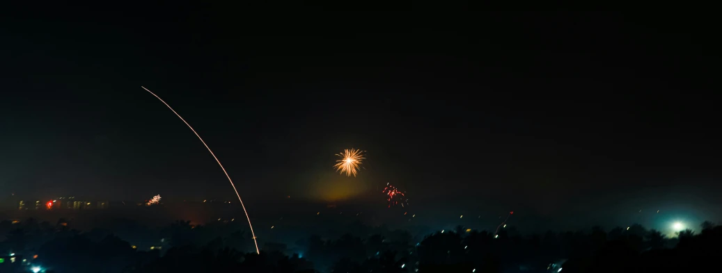 some lights that are in the dark with fireworks